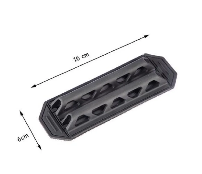 Un objeto negro con una regla al lado