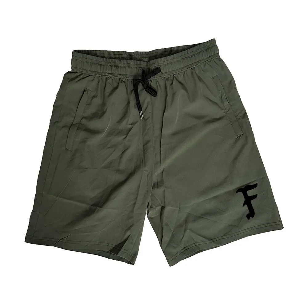Pantalones cortos secado rápido negro/verde para aire libre y correr - imagen 3