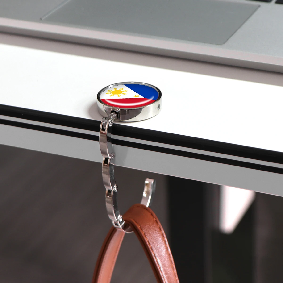 Ganchos para bolsos con bandera española, soportes plegables de Metal para bolsas de mesa, perchas portátiles para monedero, accesorios de piezas, ganchos redondos antideslizantes - imagen 2