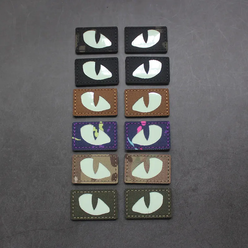 Parches tácticos luminosos de ojos de gato que brillan en la oscuridad, apliques de combate para exteriores, insignias para ropa, decoración de mochila de casco, 1 par