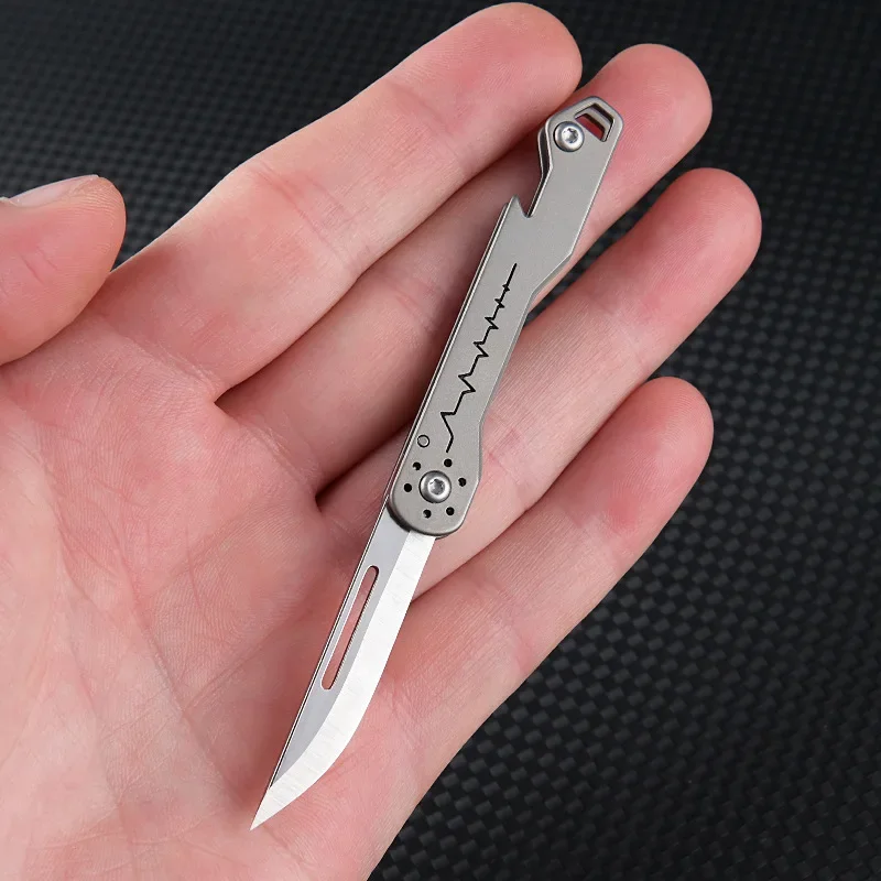 Mini cuchillo plegable táctico de titanio con abridor de botellas - imagen 5