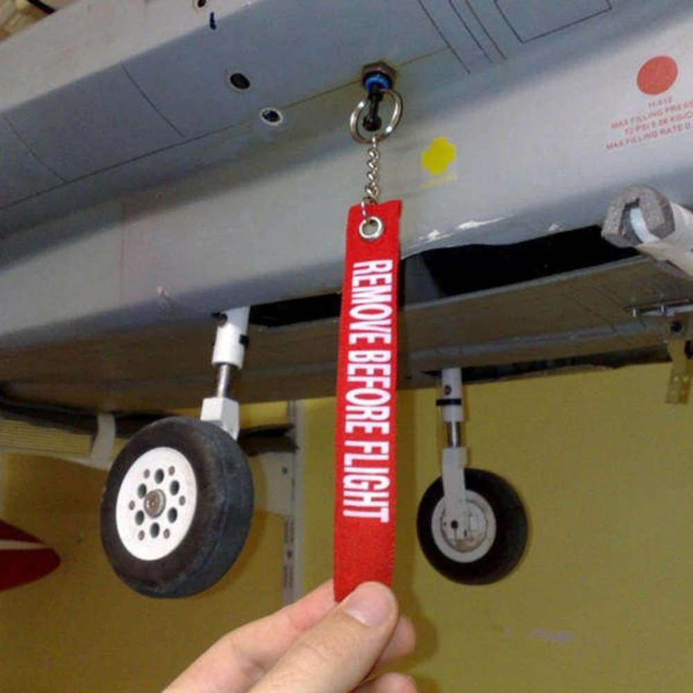 Llavero militar con cinta roja Retirar antes del vuelo - imagen 4