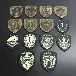 Parche reflectante camuflaje tipo escudo con gancho para mochila