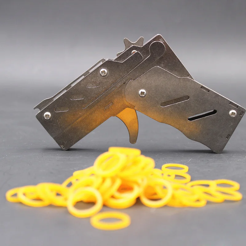 Mini pistola de goma plegable de acero inoxidable, lanzador de tiro, juguetes para niños, regalo de cumpleaños, accesorios de juego divertidos, plata, nuevo, 2022 - imagen 2