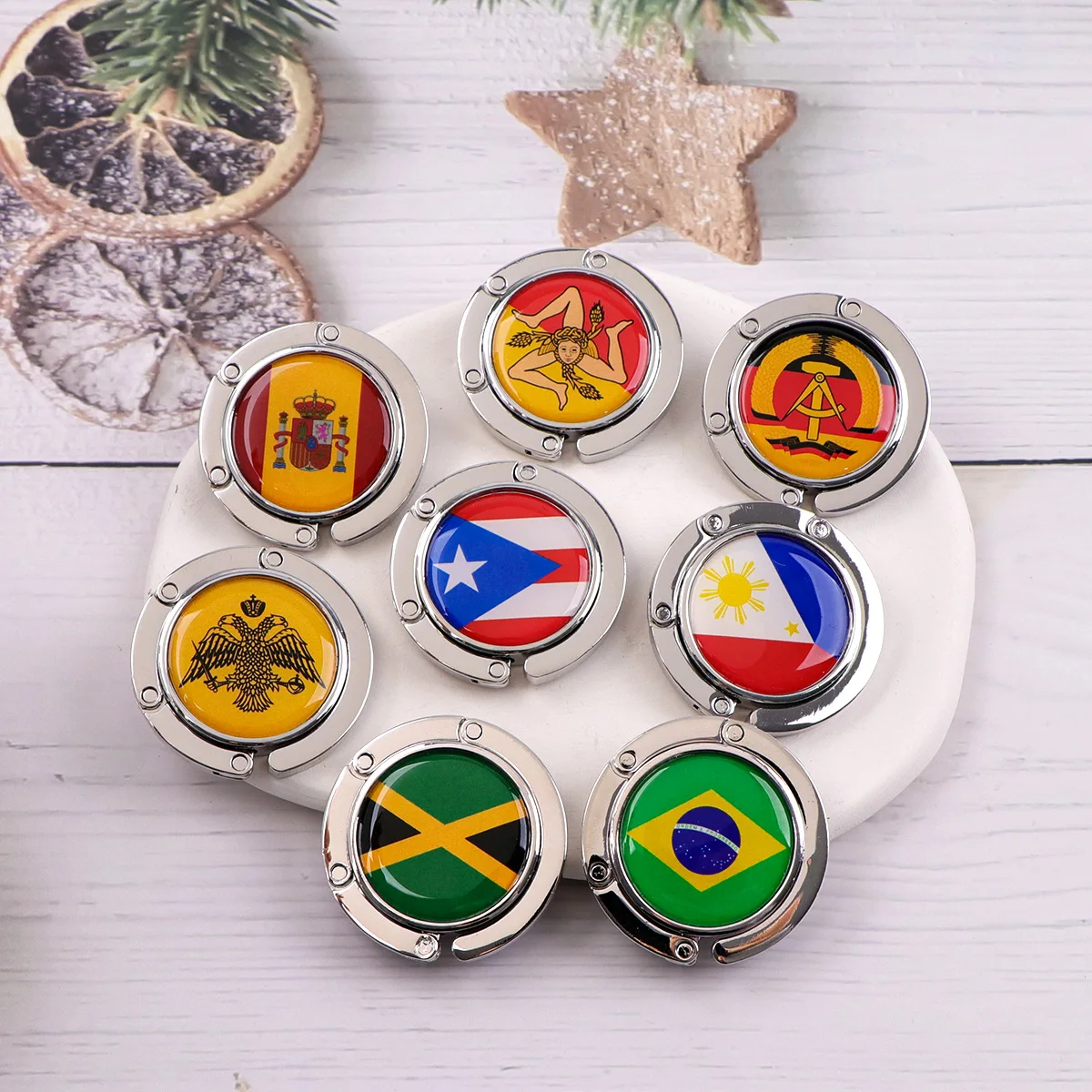 Ganchos para bolsos con bandera española, soportes plegables de Metal para bolsas de mesa, perchas portátiles para monedero, accesorios de piezas, ganchos redondos antideslizantes