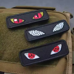 Parche táctico luminoso ojo de gato – Emblema moral para mochila