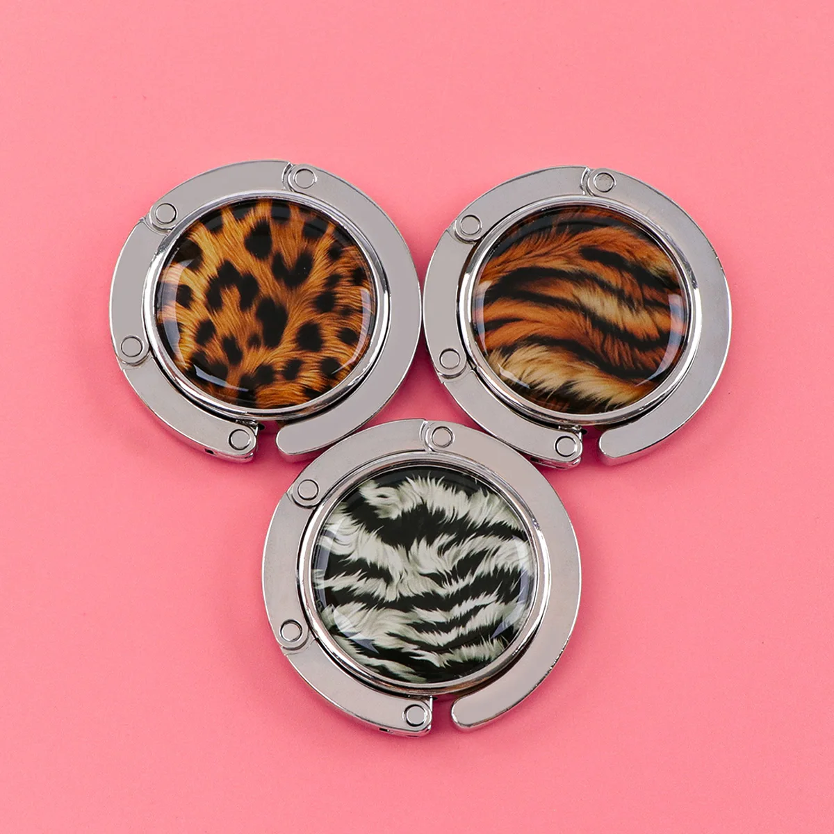 Ganchos para bolsos con estampado de leopardo, soportes plegables de Metal para bolsas de mesa, perchas portátiles para monedero, accesorios de piezas únicas, ganchos antideslizantes - imagen 5