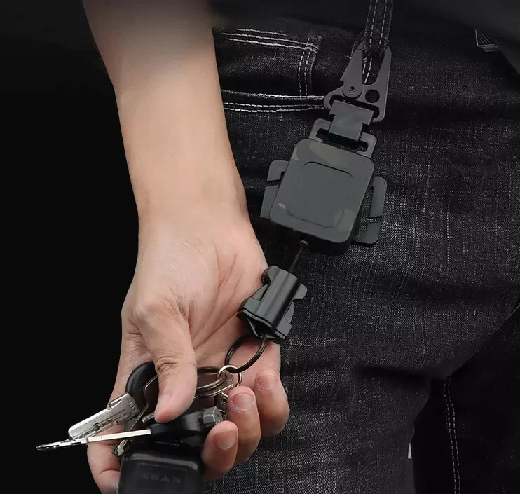 Eslinga retráctil para pistola táctica, cuerda giratoria de nailon, Clip de acero metálico, llavero, almacenamiento de llaves, accesorios para Paintball Airsoft y caza - imagen 2