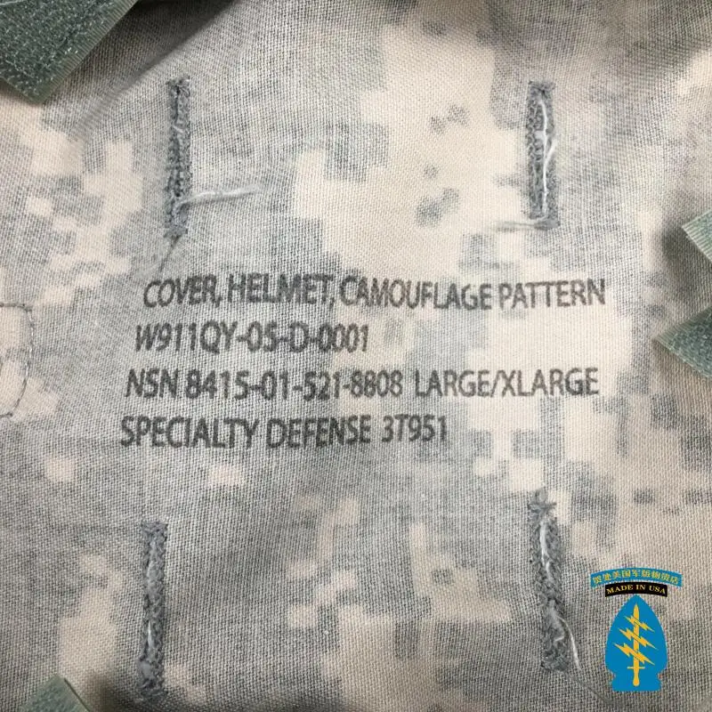 Una tela estampada de camuflaje con una etiqueta que dice casco de cubierta, patrón de camuflaje, W91111-QY-500-0011