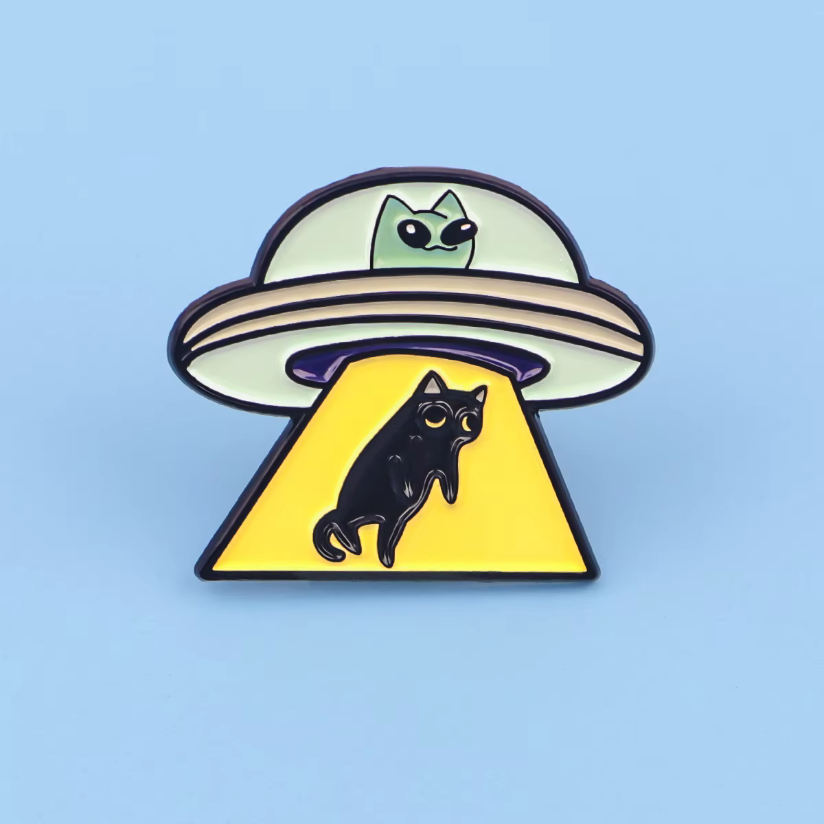 Detalle del diseño de gato y OVNI