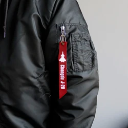 Llavero militar con cinta roja Retirar antes del vuelo