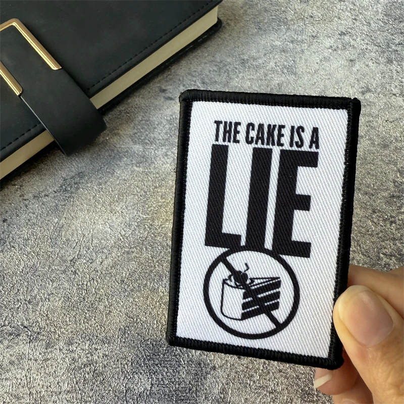 Portal The Cake Is A Lie Morale parche táctico insignia militar parche brazalete gancho y bucle mochila al aire libre accesorios pegatinas - imagen 4