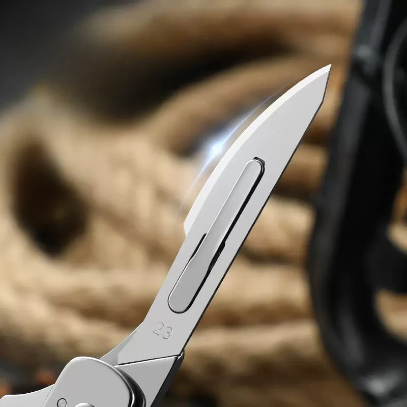 Cuchillo táctico plegable acero inoxidable con llavero para exteriores - imagen 3