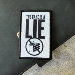 Portal The Cake Is A Lie Morale parche táctico insignia militar parche brazalete gancho y bucle mochila al aire libre accesorios pegatinas