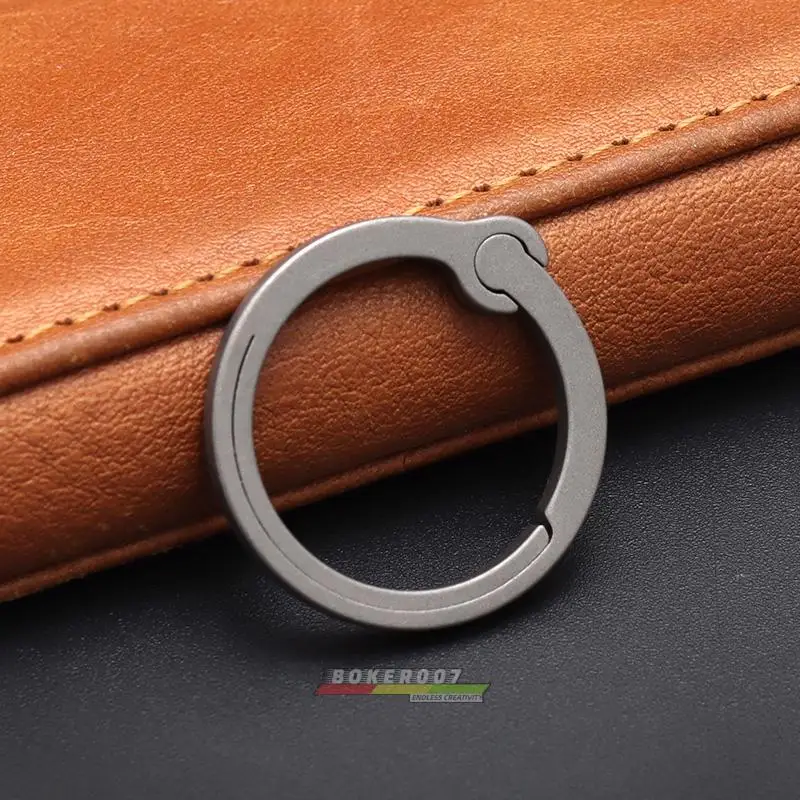 Hebilla de resorte de apertura y cierre Manual de aleación de titanio, llavero elástico creativo para coche, llavero Xiangyun - imagen 4