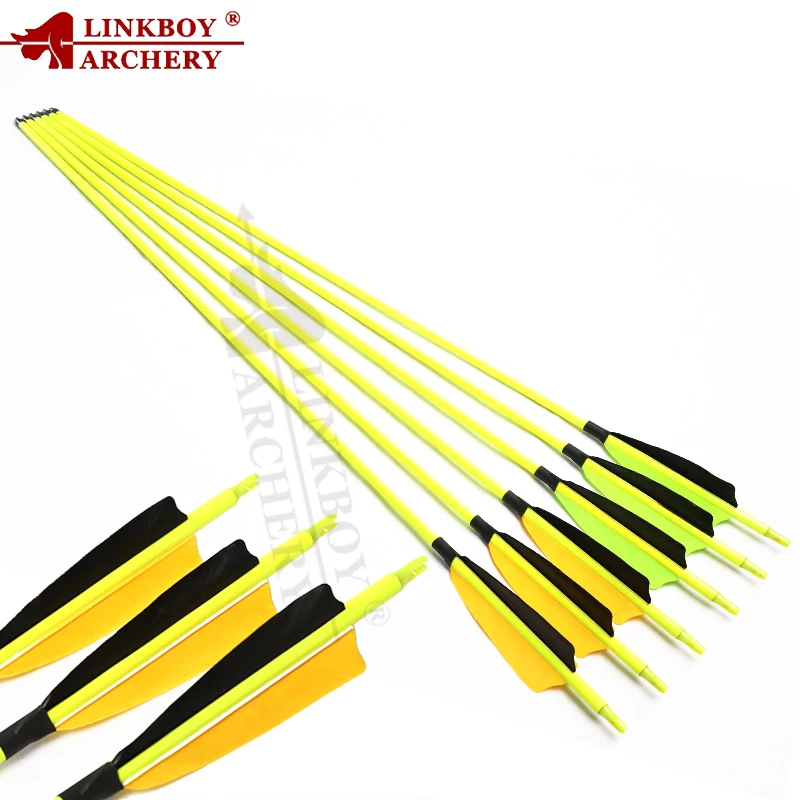 Eje con colores (amarillo/azul) y plumas