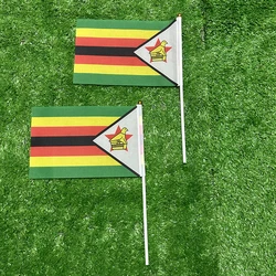 Bandera de mano Zimbabue en poliéster con asta de plástico