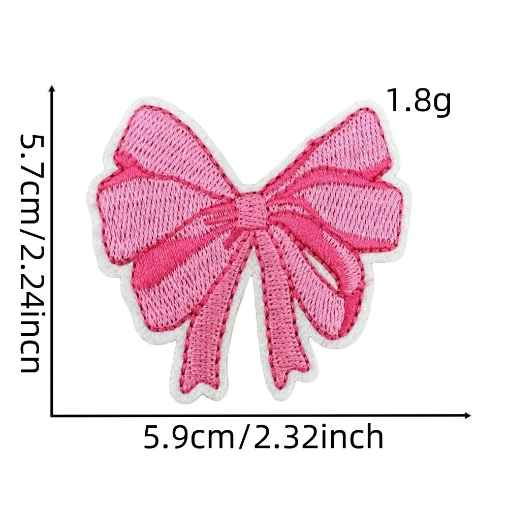 Parche de planchado dibujo animado rosa con lazo Navidad