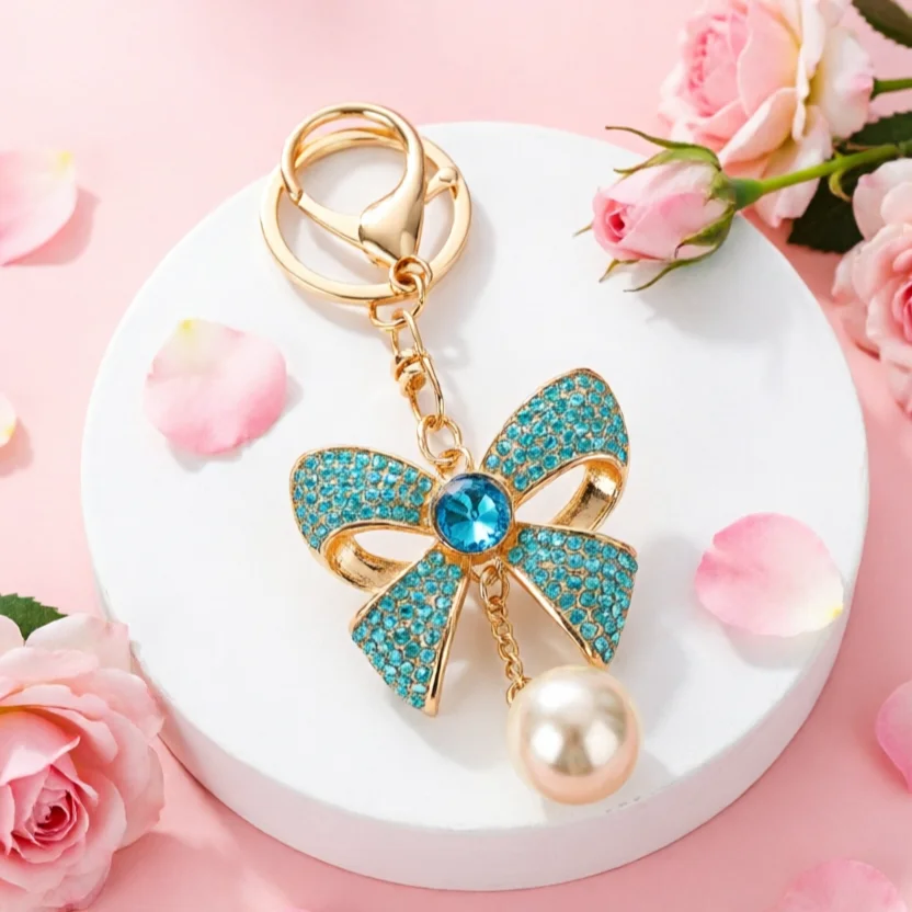 Llavero dorado con lazo, perlas y diamantes de imitación para bolso