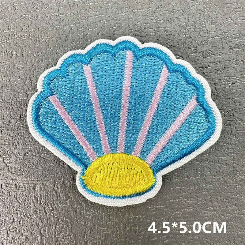 Detalle del bordado del parche de concha