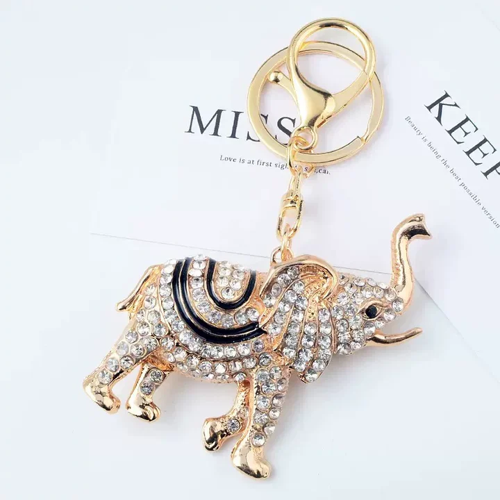 Llavero elefante con diamantes de imitación y colgante dorado - imagen 3