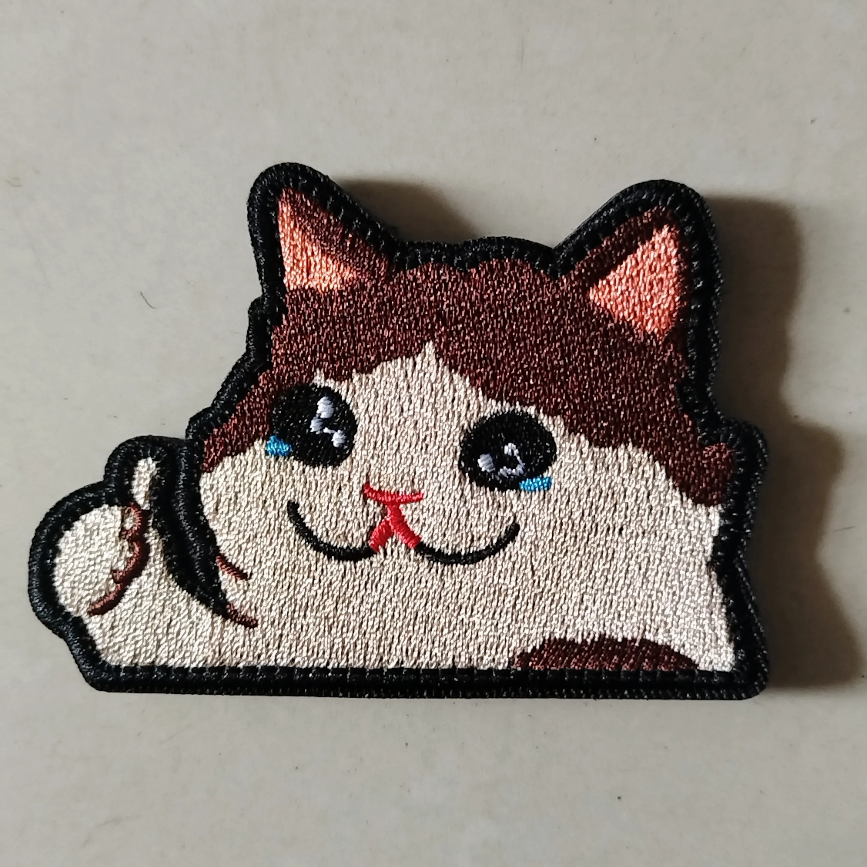 Parche gato llorando - detalle