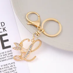Llavero metálico con cristal dorado y letras para bolso