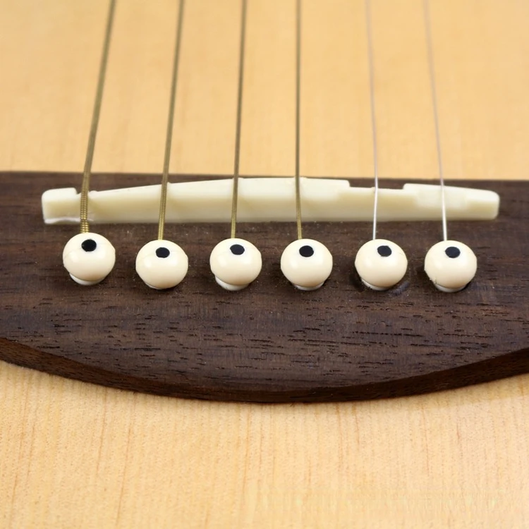 Clavijas de puente de guitarra acústicas vista lateral