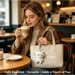 llavero de peluche gato con auriculares para mochila y bolso
