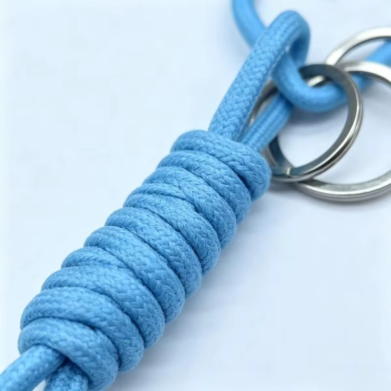Llavero táctico de paracord con motivo cámara flash y cordón