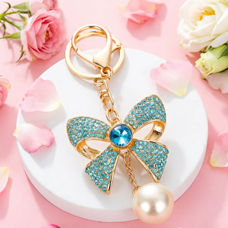 Llavero dorado con lazo, perlas y diamantes de imitación para bolso - imagen 2