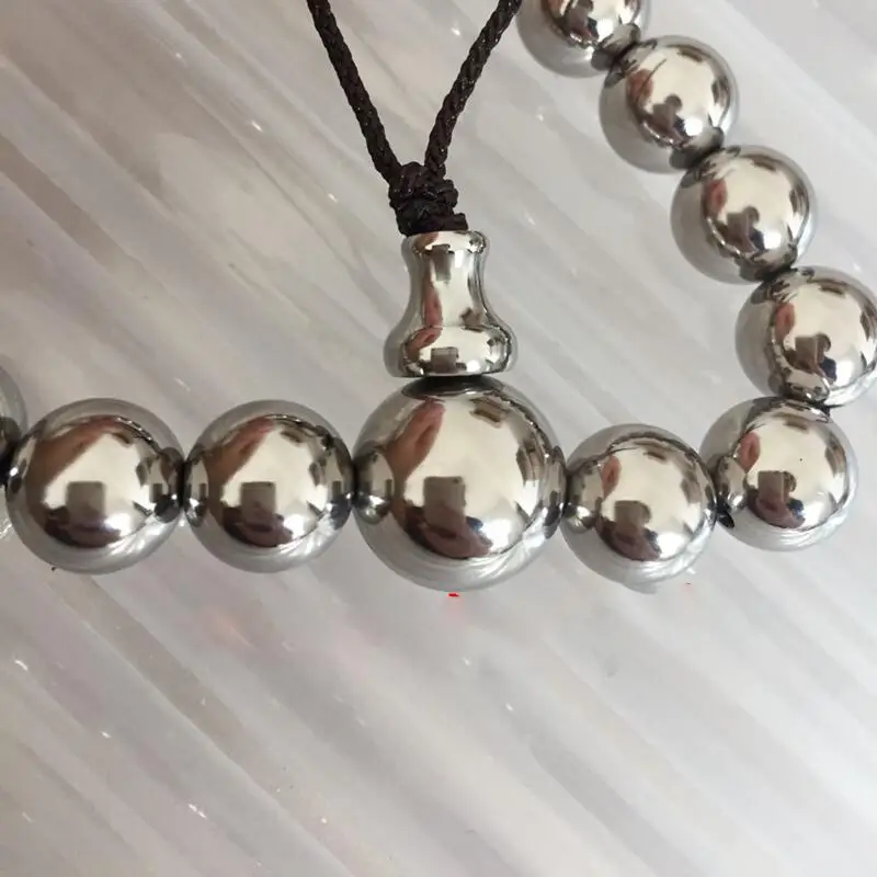 Pulsera de bolas de titanio pulido y cabezal