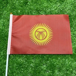 Bandera Kirguistán de mano con asta de plástico