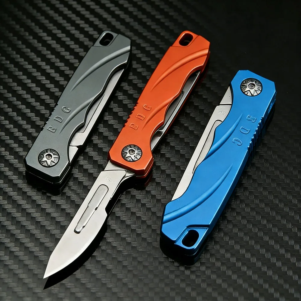 Navaja plegable mini con cuchilla pequeña y llavero para paquetes - imagen 4