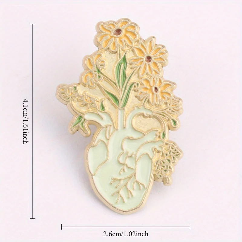 Broche corazón anatómico floral en resina dorada - imagen 5