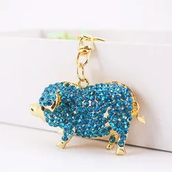 Llavero cerdo con cristales azules – Colgante metal dorado para bolso