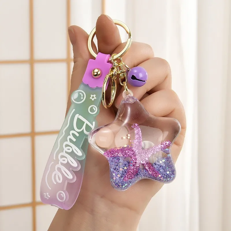 Llavero criaturas marinas: pez de cristal y delfín para bolso - imagen 3