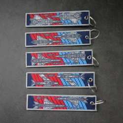 Llavero táctico flecha con tira identificación PVC para mochila