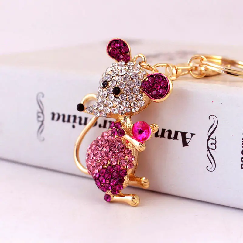 Llavero elefante con diamantes de imitación y colgante dorado