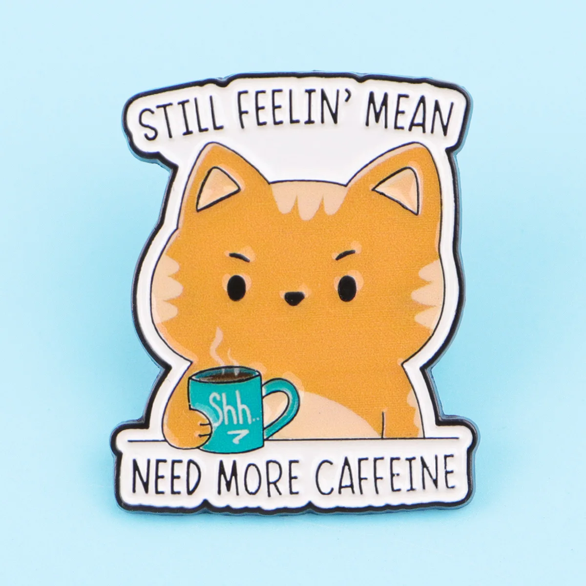 Pin de gato naranja con frase de café