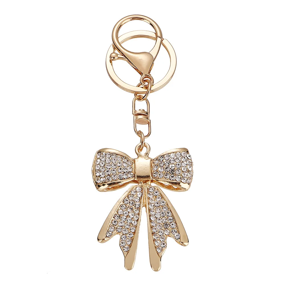 Llavero de cristal dorado con lazo brillante para bolso femenino