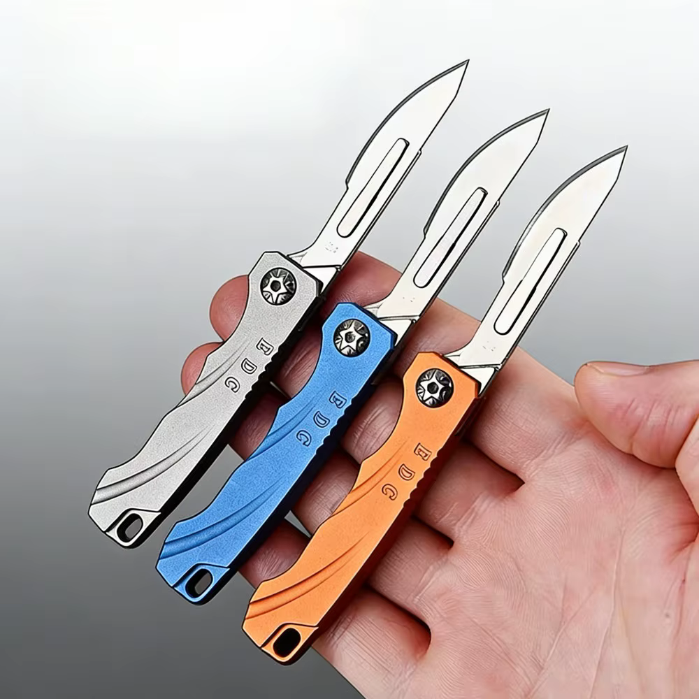Navaja plegable mini con cuchilla pequeña y llavero para paquetes - imagen 2