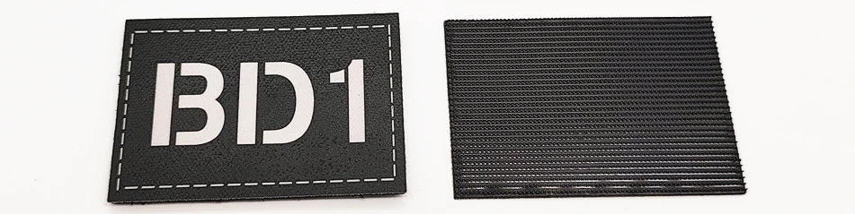 Parche táctico negro con numeración BD1, BD2, BD3 y BD4