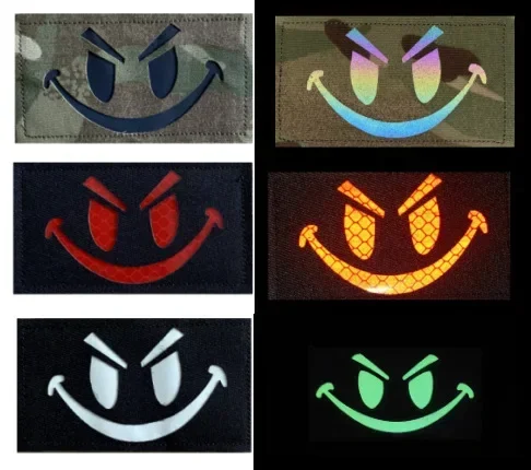 Parche reflectante cara sonriente velcro trasero para mochila