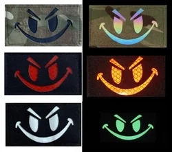 Parche reflectante cara sonriente velcro trasero para mochila