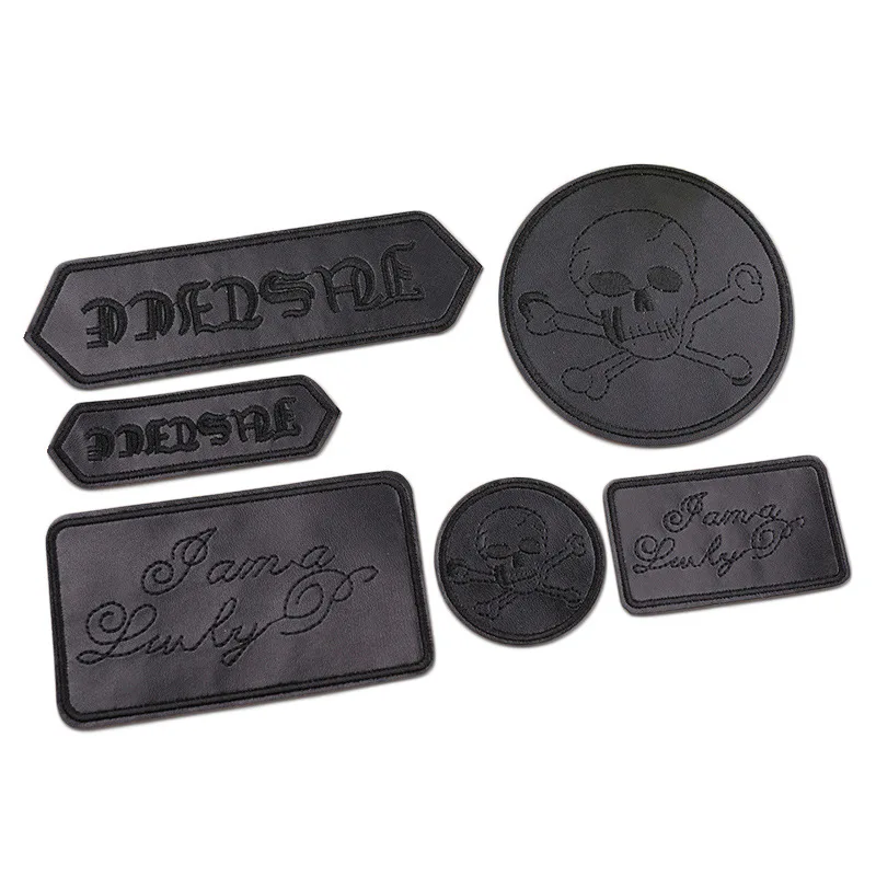 Parche bordado táctico redondo espiga cruzada PU negro para planchar