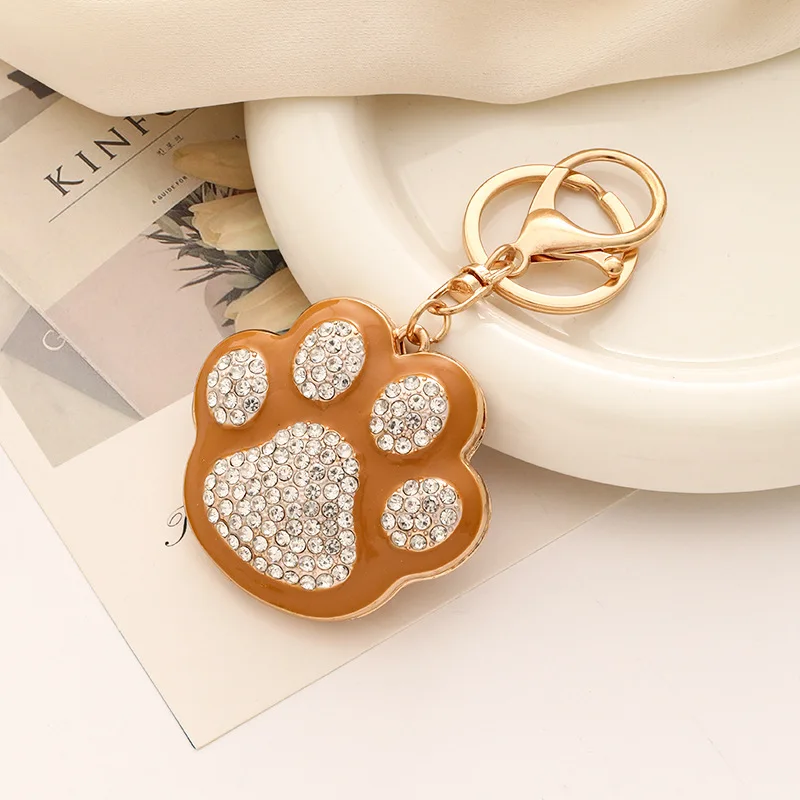 Llavero metálico huella de pata cristal brillante para mujer