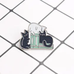 Broche vintage gato y libro – accesorio encantador para leer