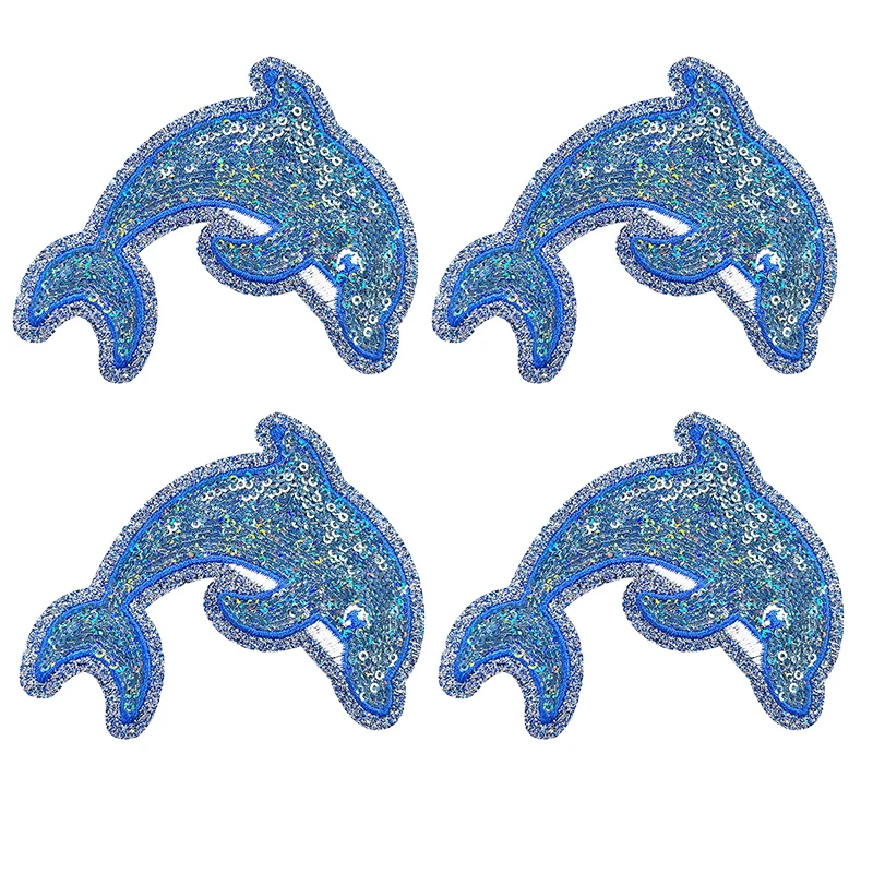 Detalle de diseños de ballena y concha en lentejuelas