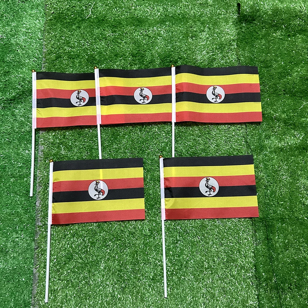 Bandera de Uganda mano en poliéster con asta plástica
